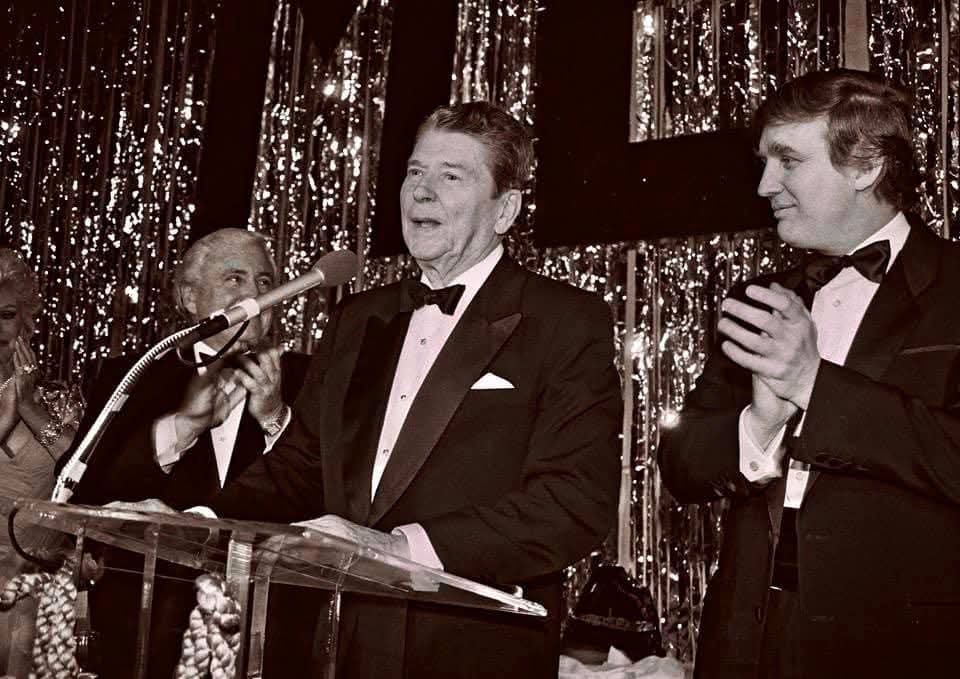 Donald Trump clapping for US President Ronald Reagan at an event (Photo: Facebook/Donald Trump)